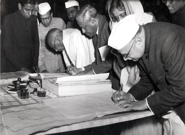 Jagjivan Ram, Sardar Vallabhbhai Patel and Rajkumari Amrit Kaur signing the Indian Constitution